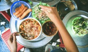 Hanoi Street Food: It's more than Phở! Sneak-peek into top 3 delicious local delights! 3 Bún Riêu served with fresh veggies and quẩy (fried dough stick)